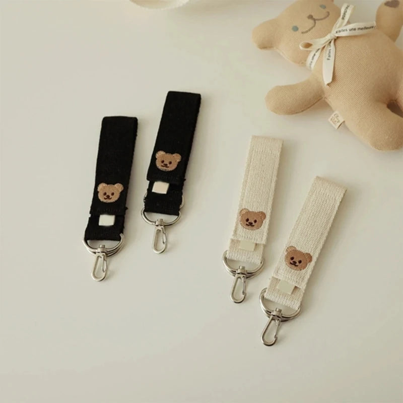 attache poussette pour sac a langer