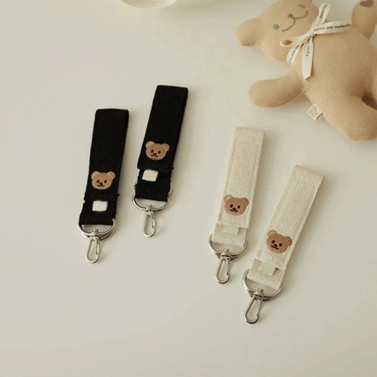 attache poussette pour sac a langer