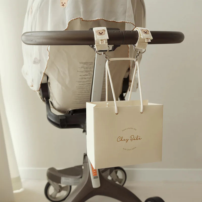 attache poussette pour sac a langer