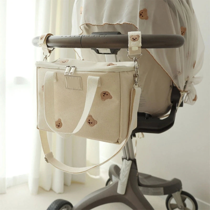 attache poussette pour sac a langer