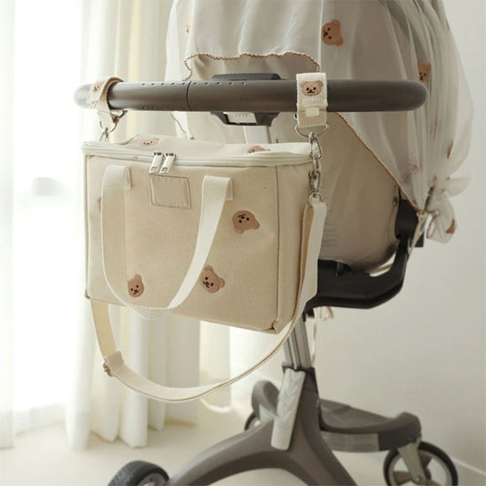 attache poussette pour sac a langer