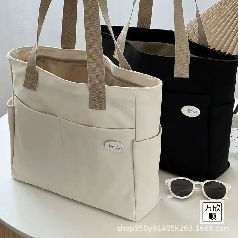 sac a langer beige et noir