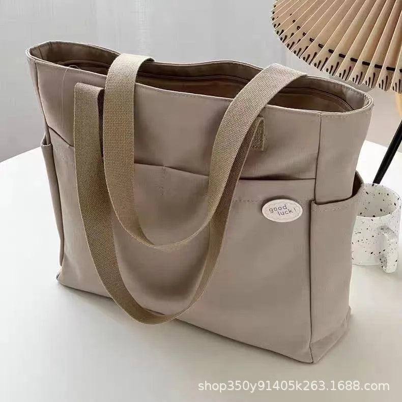 sac a langer beige et noir